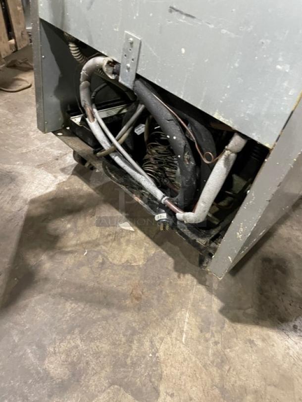 Beverage-Air stainless steel reach-in freezer, model KF24-1AS, rear view showing wiring and casters, 115V, 1 phase.