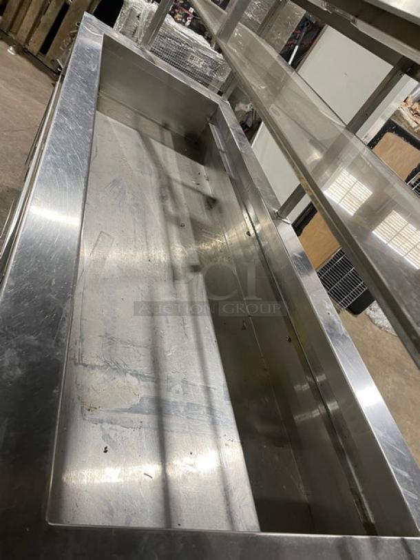 Servolift stainless steel refrigerated salad bar, Model 5055RCW, with overhead sneeze guard, cabinet base, on casters.