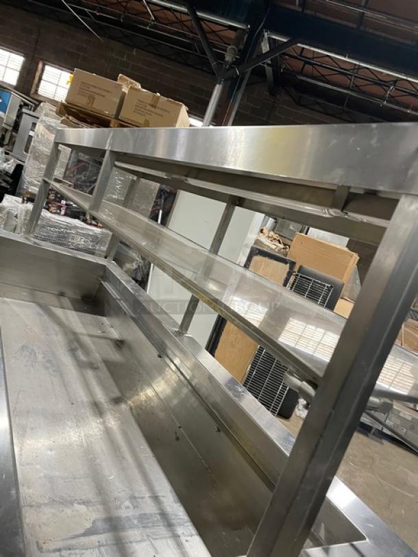 Servolift stainless steel refrigerated salad bar, model 5055RCW, with sneeze guard, overhead shelf, cabinet base, on casters.