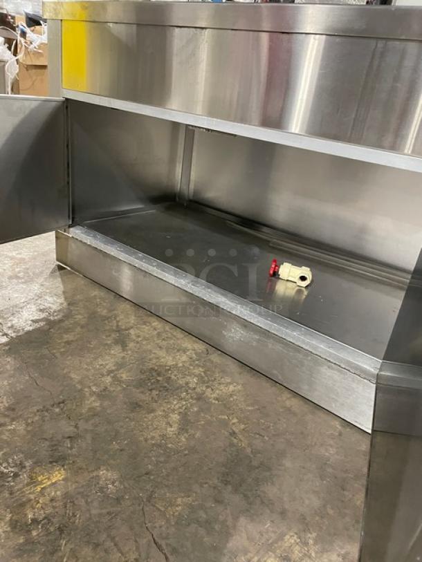 Servolift refrigerated stainless steel salad bar, model 5055RCW, with sneeze guard, cabinet base, and overhead shelf on casters.