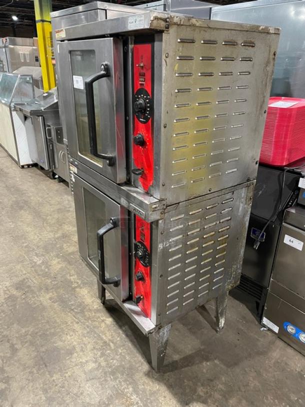 Vulcan stainless steel double-stacked convection oven, natural gas powered, with wired rack, on legs. Visible wear.