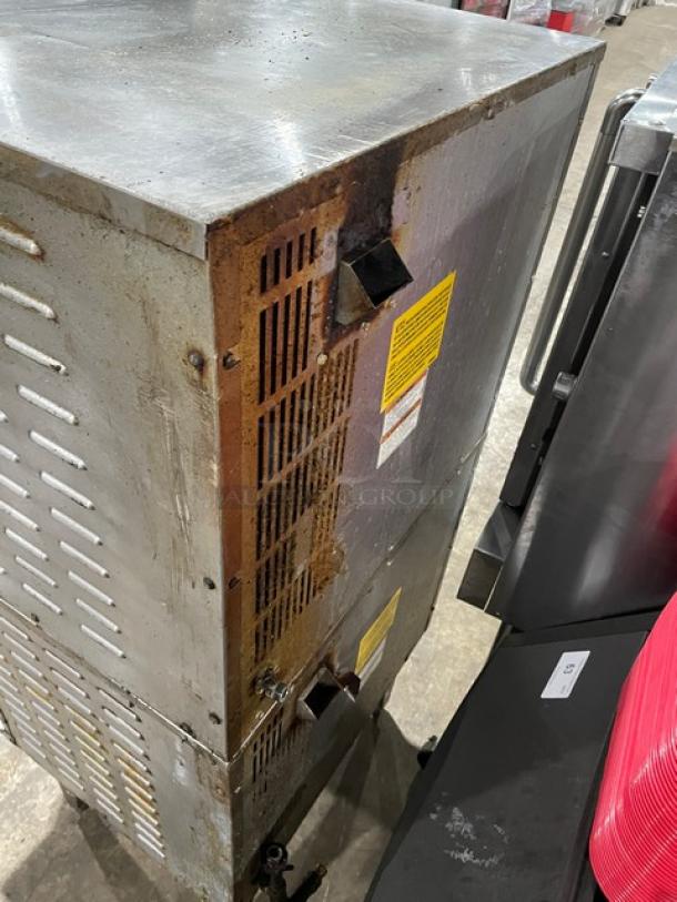 Vulcan commercial stainless steel double stacked convection oven, natural gas powered, with visible wear, on legs.