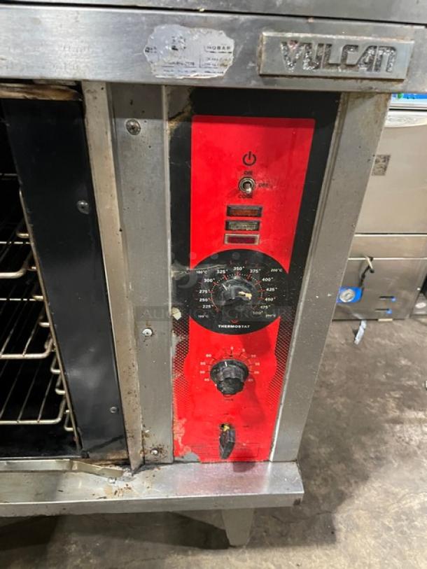 Vulcan commercial stainless steel double stacked convection oven, natural gas, with wired rack, visible wear, branded control panel.