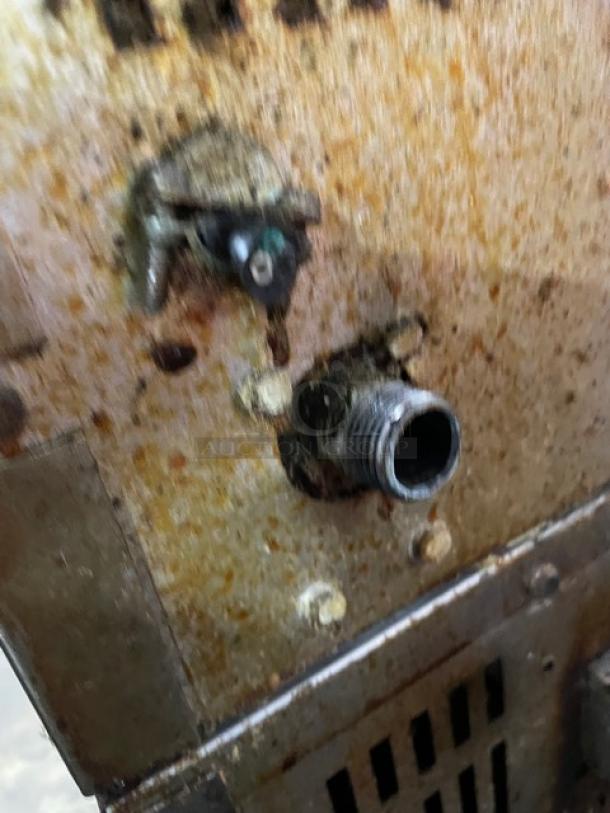 Vulcan stainless steel convection oven back view showing natural gas connection; visible rust and wear. Suitable for commercial kitchens.