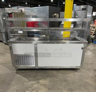 Servolift stainless steel refrigerated salad bar with sneeze guard, Model 502-5R-CW, cabinet base, 120V, on casters.
