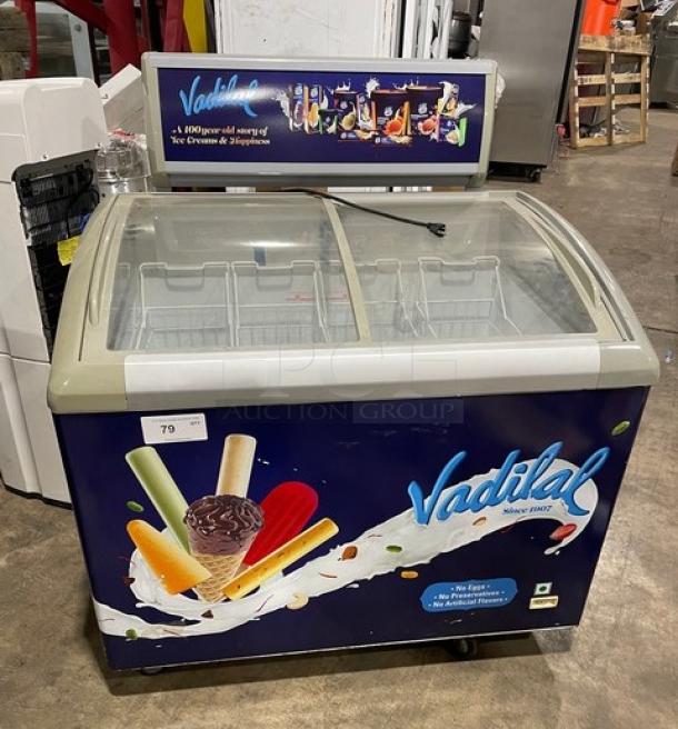 Excelente CF-289 ice cream merchandiser, 2018, curved glass top, poly-coated wire baskets, on casters, working condition.