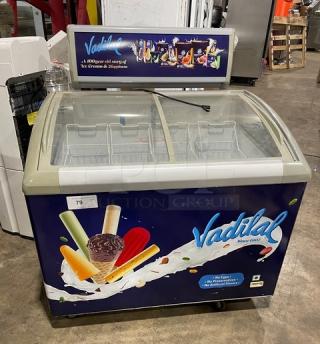 Excelente CF-289 ice cream merchandiser, 2018, curved glass top, poly-coated wire baskets, on casters, working condition.