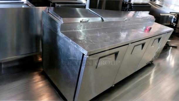 Outstanding condition True TPP-93 refrigerated pizza prep table, 93", 115V, fully tested and working, stainless steel finish.