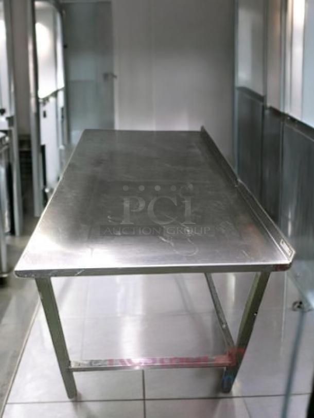 Commercial grade stainless steel prep table, 60"x36"x36", immaculate condition, heavy-duty model, fully cleaned.