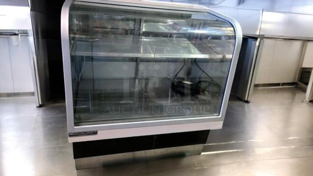 Outstanding condition Schmidt EHD-4 refrigerated bakery display case, 115V, with clear glass front, fully tested and working.