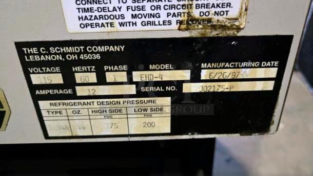 Refrigerated display case tag showing Schmidt EHD-4 model, 115V, manufactured on 6/26/97, in excellent condition.