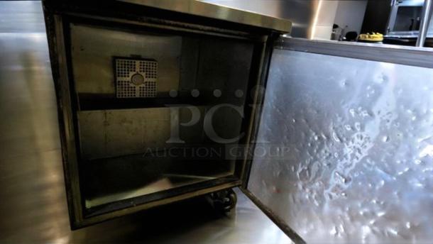 True TWT-27F one door undercounter freezer, stainless steel, outstanding condition, interior shelf, 115V, fully tested.