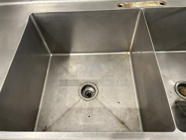 All stainless steel heavy duty 3 compartment bakery sink with 22"x22" basins, tested and working, minor wear visible.