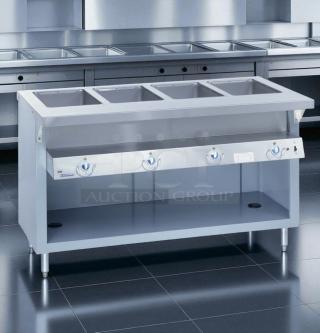 Rare Duke E-4-DLSS 60" hot food table, 4 wells, cutting board, 208V, tested, excellent condition, ideal for commercial use.