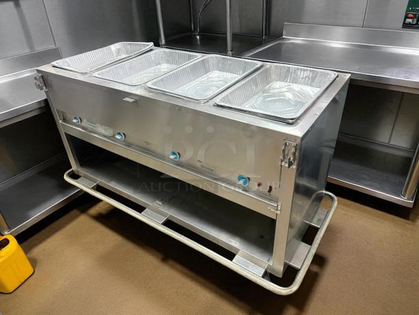 Duke E-4-DLSS 60" hot food table, four wells, cutting board, 208V/1PH, stainless steel, excellent condition, fully tested.