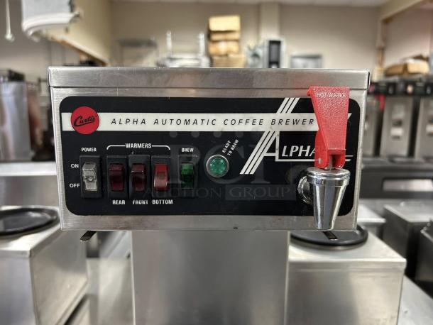 Curtis ALP3GTR12A000 12-cup coffee brewer, metal, with 3 lower warmers, tested and working, panel with controls and labels.