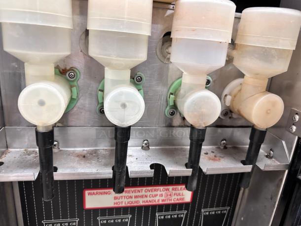 Curtis PC-40 Primo Cappuccino Dispenser, superb condition, stainless steel, 120V, fully tested. Visible warning label for safety.