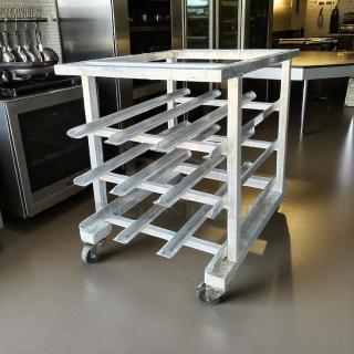 New Age half-size mobile aluminum can rack, excellent condition, for #10 & #5 cans, no cutting board, industrial setting.