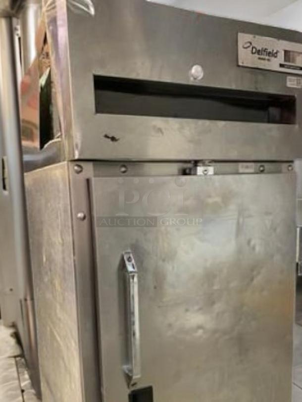 Delfield 6025XL-S single door reach-in refrigerator in superb condition. Stainless steel finish, tested and working.