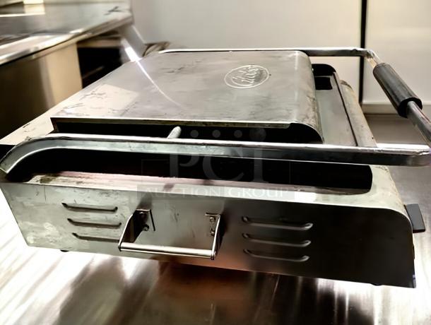 Globe GSG14D Deluxe Panini Grill in outstanding condition, stainless steel, tested and working, 120V. Brand logo visible.