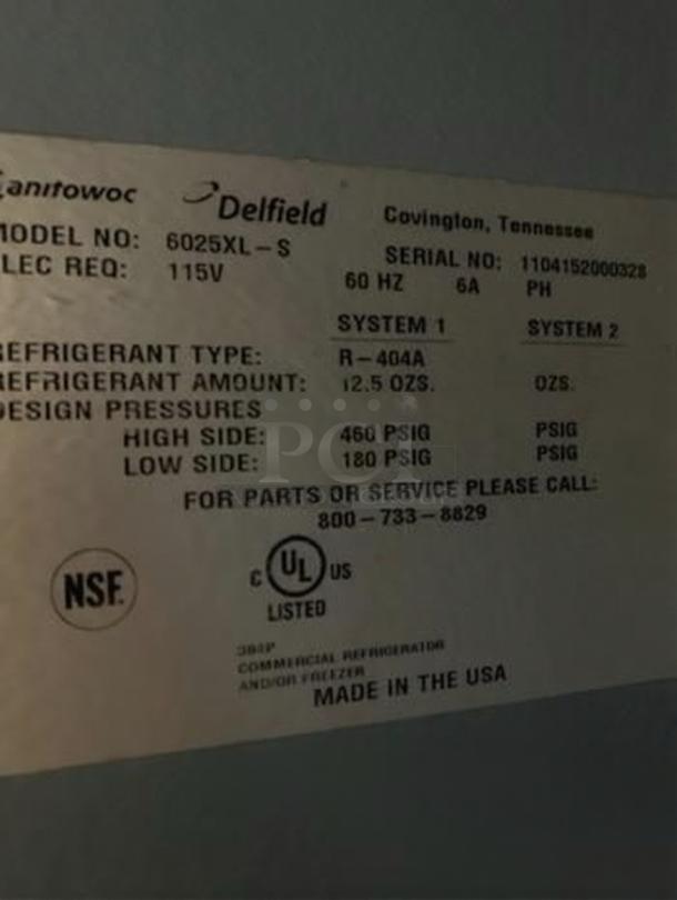 Alt text: Delfield 6025XL-S refrigerator label showing model, serial number, voltage, refrigerant type, NSF and UL certifications.