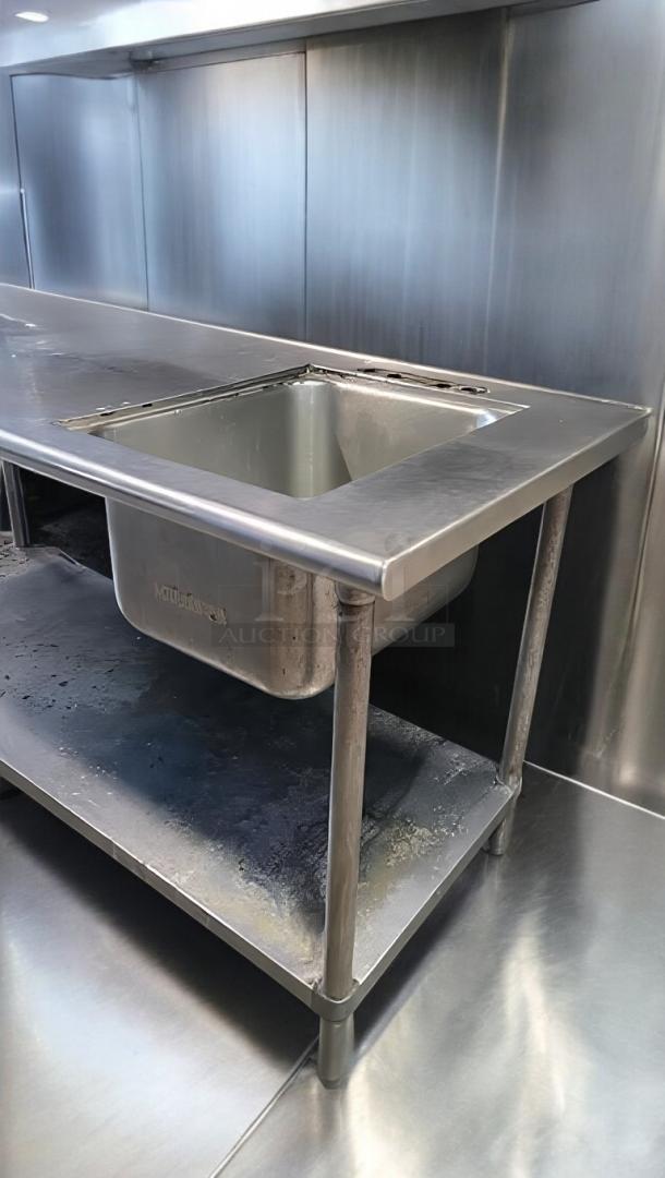 Stainless steel work table by Custom Commercial Fabrication, 72"x30"x40", integrated sink, can opener mount, top-tier condition.