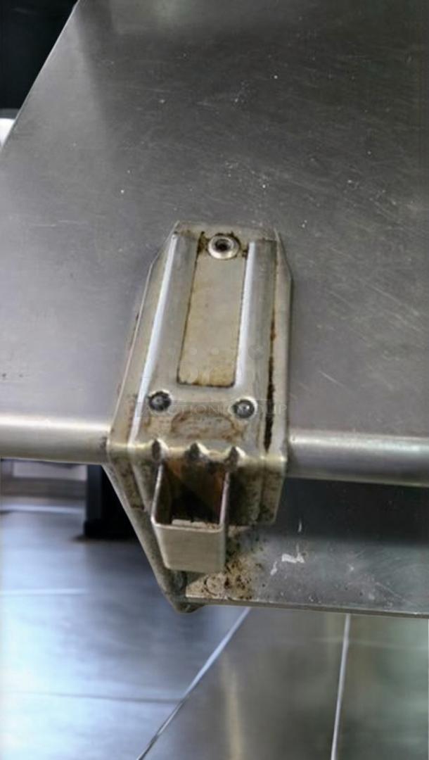 Stainless steel work table with integrated sink, can opener mount by Custom Commercial Fabrication, 72"x30"x40", top-tier condition.