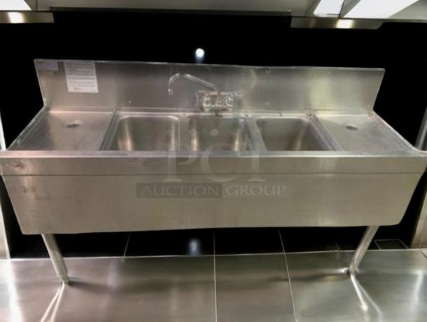 Superb condition stainless steel 3-compartment bar sink by Commercial Stainless Fabrication, 60"x19"x35", with faucet and drainboards.
