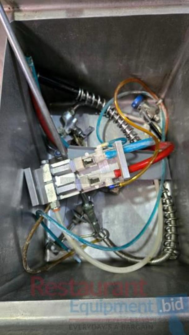 Stainless steel 3-compartment sink with exposed wiring for faucet and electrical access, excellent condition.