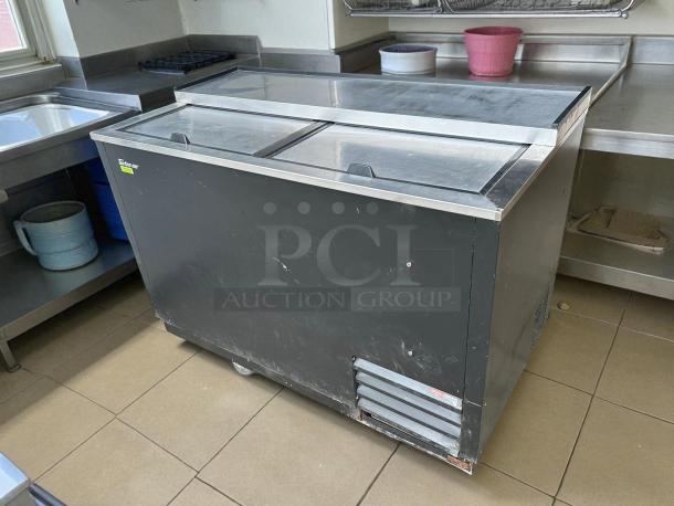 Turbo Air TBC-50SB-N6 50" bottle cooler with two solid sliding doors, black finish, tested and working, minor surface wear.