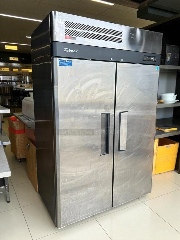 Turbo Air M3F47-2-N 52" stainless steel reach-in freezer, excellent condition, tested and working, with visible brand logo.