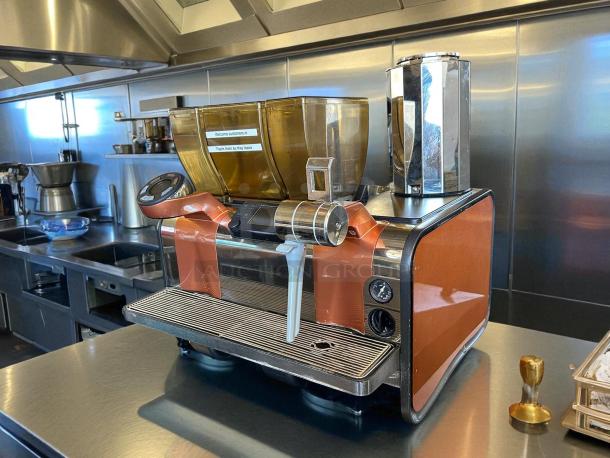 Starbucks Thermoplan Mastrena II Espresso Machine, 220v, 3ph, in working condition. Features pump, orange panels, tested.