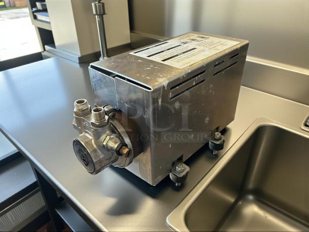 Starbucks Thermoplan Mastrena II espresso machine pump, 220v, 3ph. Metal casing, tested and working, slight wear.