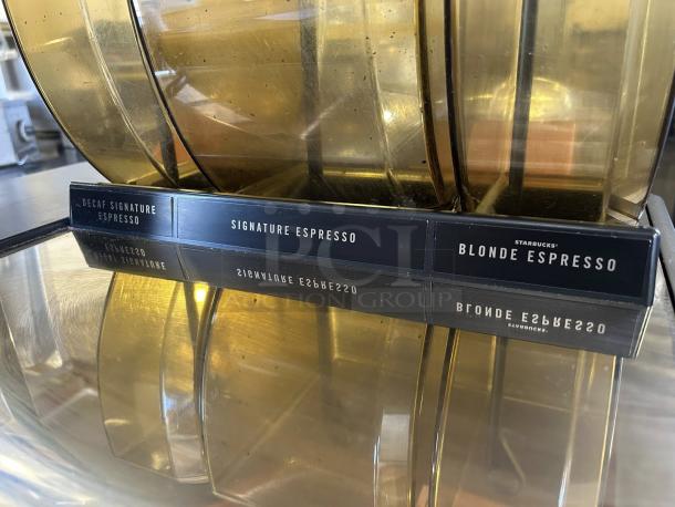 Starbucks Thermoplan Mastrena II Espresso Machine labels for Decaf, Signature, and Blonde Espresso.