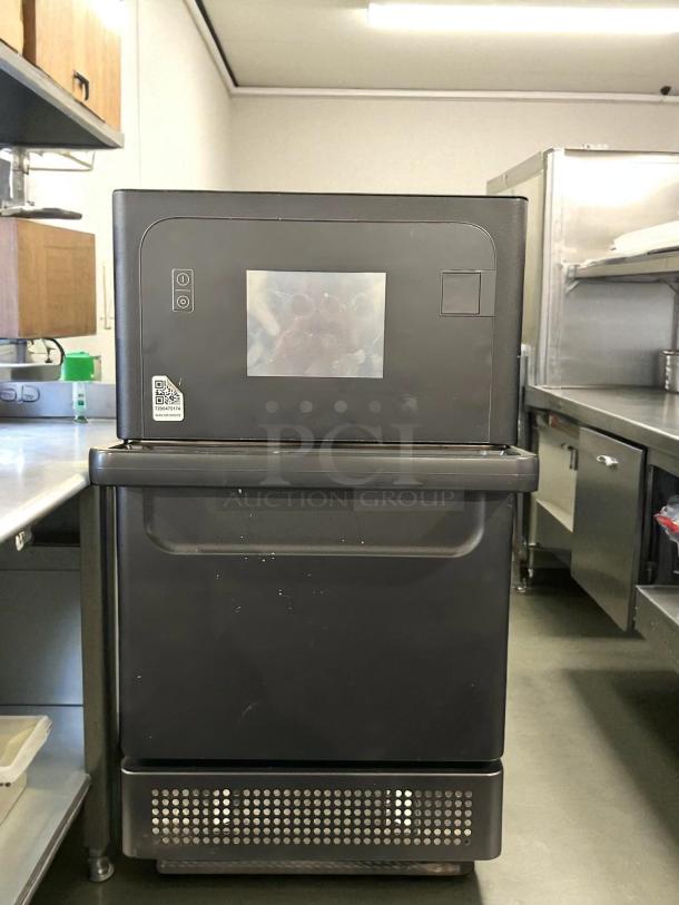 Merrychef eikon e2s High Trend oven, black, ventless, electric, fully tested. QR code visible on front. Great condition.