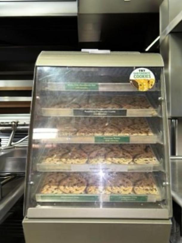 Subway 4-Tier Cookie Display Case in superb condition. Features four shelves, clear front, branding labels, fully tested, and working.