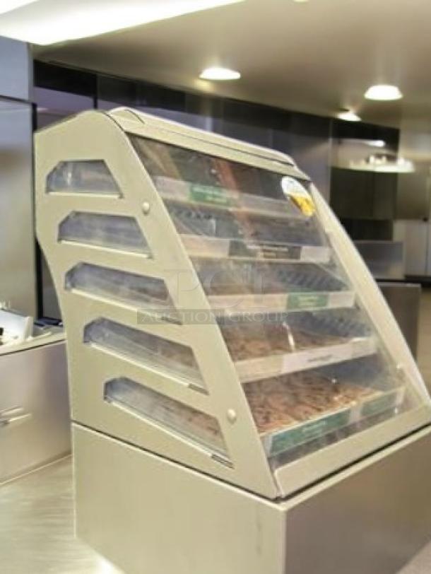 Subway 4-tier cookie display case in superb condition. Clear panels, metal frame. Used for bakery merchandising. Fully tested.