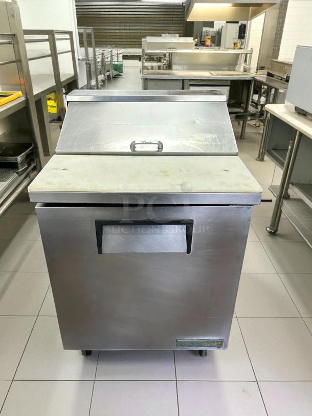 True TSSU-27-08 refrigerated prep table in great condition; stainless steel, single door, tested, working, with prep surface.