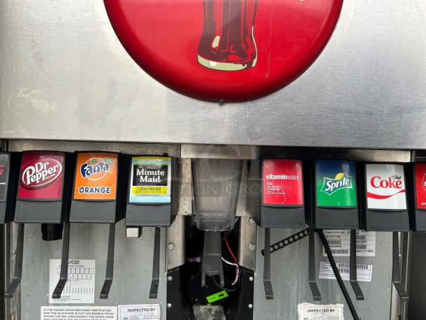 Lancer Model 85-4548H-111 ice and drink dispenser, 250lb storage, cup fill, tested, visible Dr Pepper, Fanta, Minute Maid, Sprite, Diet Coke, and Vitaminwater options.