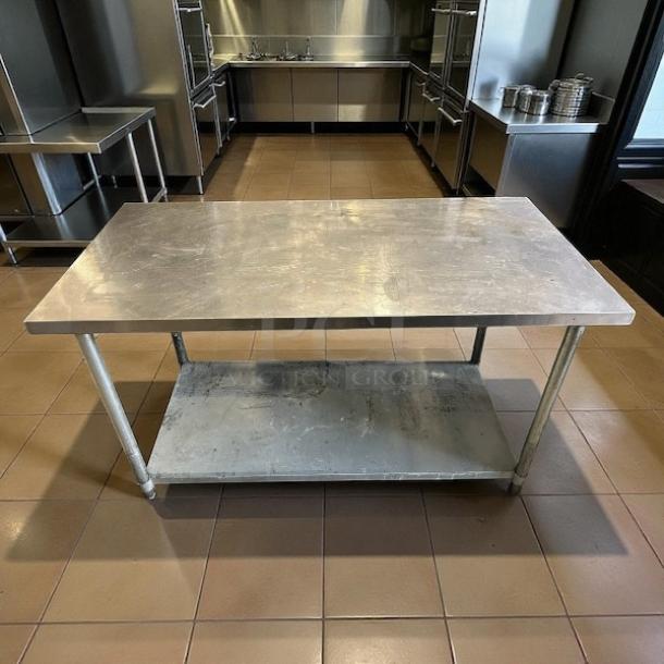 GSW USA WT-P3060 stainless steel work table, 30" x 60", excellent condition, features durable surface and lower shelf.