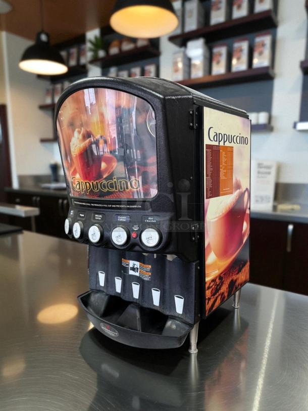 Grindmaster PIC5 five-flavor beverage dispenser in excellent condition, tested and working, with cappuccino graphics.