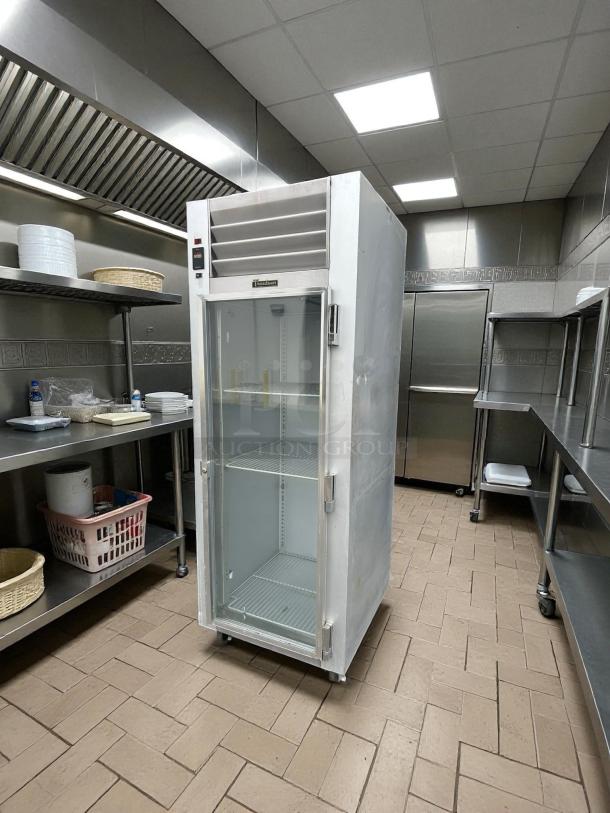 Traulsen G11010 30" Reach-In Refrigerator, right-hinged glass door, tested and working, in commercial kitchen setting.