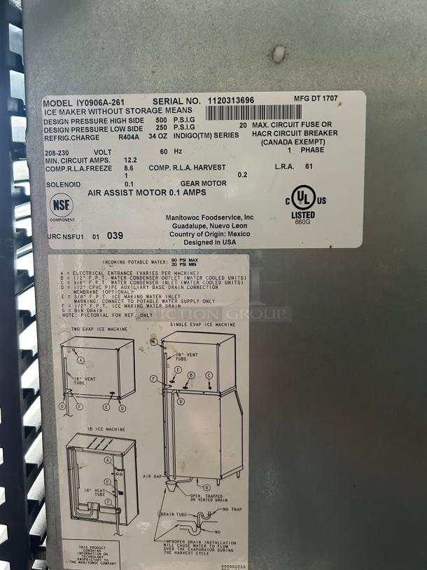 Manitowoc IYT0900A ice machine head, air cooled, half dice, 865 lb capacity. Labels show specs and working condition.