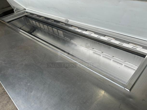 Everest Refrigeration EPBNR3 71 1/8" salad prep table, featuring a stainless steel refrigerated base, tested and working condition.