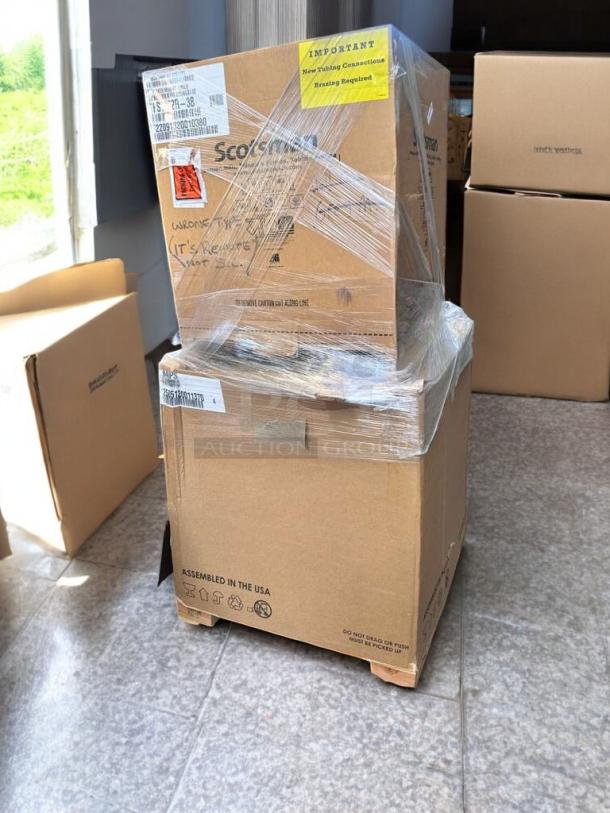 Brand new Scotsman FS1222R-32 Prodigy Plus ice maker, flake style, 1250 lb/day, in packaging with labels visible.