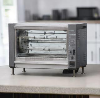 Excellent condition Hickory N/5.5 E electric rotisserie oven with 5 spits, tested and working, stainless steel exterior.