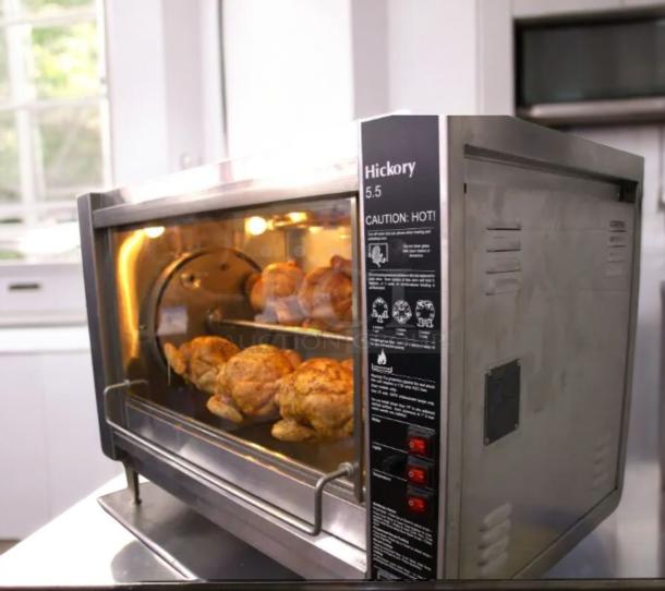 Excellent condition Hickory Industries N/5.5 E electric rotisserie oven with 5 spits, tested and working, caution labels visible.