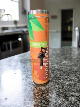 BUNN TD4T unsweetened iced tea dispenser, stainless steel, excellent condition, with colorful label and working spout.