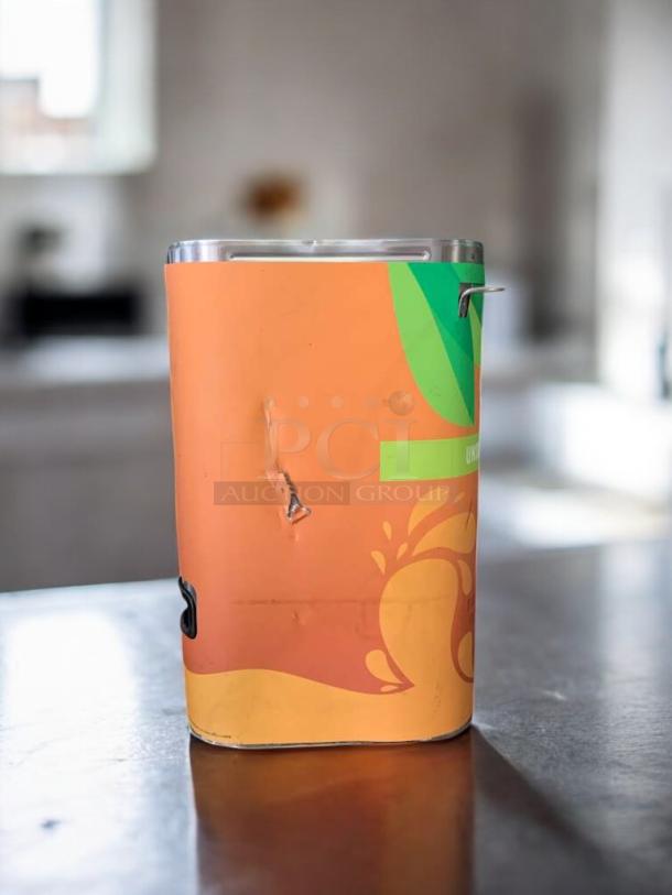 BUNN TD4T unsweetened iced tea dispenser in stainless steel, excellent condition, tested and working, with colorful wrap design.