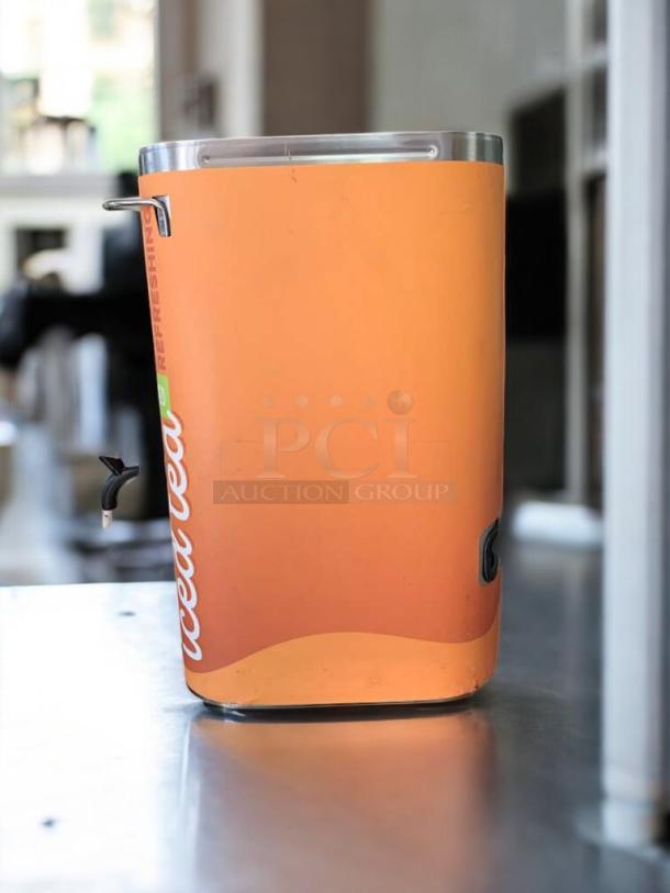 BUNN TD4T Iced Tea Dispenser, stainless steel, excellent condition, unsweetened, tested and working, orange exterior design.